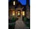 Charming brick home featuring a welcoming arched entryway and a meticulously landscaped front yard, creating a cozy curb appeal at 324 N 5Th St, Albemarle, NC 28001