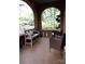Inviting front porch featuring decorative tile, an archway, and comfortable seating furniture at 324 N 5Th St, Albemarle, NC 28001