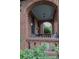 Arched brick porch featuring a seating area and decorative plants, creating a welcoming entrance at 324 N 5Th St, Albemarle, NC 28001