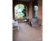 Inviting brick porch offering a cozy seating area with tiled flooring and an open view at 324 N 5Th St, Albemarle, NC 28001