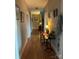 Bright hallway with hardwood floors, decorative lighting, and staircase at 324 N 5Th St, Albemarle, NC 28001