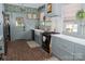 Charming kitchen featuring custom cabinets, countertops, a farm sink, and modern appliances at 324 N 5Th St, Albemarle, NC 28001