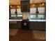 Updated kitchen featuring a farmhouse sink, custom cabinets, and modern appliances at 324 N 5Th St, Albemarle, NC 28001