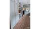 Stylish kitchen with brick flooring, shaker cabinets, wine racks, and modern appliances at 324 N 5Th St, Albemarle, NC 28001
