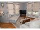 Inviting living room with hardwood floors, a sectional couch and large screen TV at 324 N 5Th St, Albemarle, NC 28001