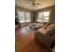 Inviting living room with natural light, comfortable seating, and hardwood floors at 324 N 5Th St, Albemarle, NC 28001
