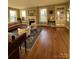 Bright living room features hardwood floors, a decorative fireplace, and multiple windows for natural light at 324 N 5Th St, Albemarle, NC 28001