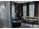 Cozy living room featuring large windows, stylish furniture, and an open layout at 324 N 5Th St, Albemarle, NC 28001