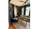 Cozy living room with hardwood floors, large windows, comfortable seating, and a ceiling fan at 324 N 5Th St, Albemarle, NC 28001