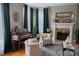 Inviting living room featuring a piano, fireplace, armchairs, and tasteful decor for comfortable living at 324 N 5Th St, Albemarle, NC 28001