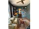 Comfortable living room featuring built-in bookshelves, natural light, and stylish decor at 324 N 5Th St, Albemarle, NC 28001