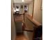View of the staircase and upper hallway showcasing wood floors and classic railing details at 324 N 5Th St, Albemarle, NC 28001