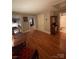 Spacious upstairs landing featuring wood floors, antique hutch, and an open layout at 324 N 5Th St, Albemarle, NC 28001