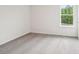 Carpeted bedroom with a large window offering ample natural light at 4016 Cramer Estates Ct, Gastonia, NC 28056