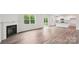 Spacious living area featuring an electric fireplace, wood-look floors, and kitchen access at 4016 Cramer Estates Ct, Gastonia, NC 28056