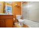 Bathroom with a vanity, toilet, and a shower-tub combination with glass doors at 42 Linford St, Belmont, NC 28012
