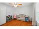 Cozy bedroom space with a crib, hardwood floors, and natural light at 42 Linford St, Belmont, NC 28012