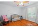 Bedroom area showcasing a crib, chair, and a window offering natural light at 42 Linford St, Belmont, NC 28012