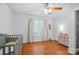 Bedroom with a crib, window, and dresser, ideal for a Bedroom setting at 42 Linford St, Belmont, NC 28012