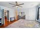 Bedroom features hardwood flooring and a ceiling fan for added comfort at 42 Linford St, Belmont, NC 28012