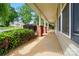 Charming covered front porch with brick supports offers a welcoming entrance at 42 Linford St, Belmont, NC 28012
