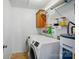 Functional laundry room includes washer, dryer, storage shelves, and water heater at 42 Linford St, Belmont, NC 28012