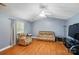 Cozy living room with wood floors, vaulted ceiling, and comfortable furnishings at 42 Linford St, Belmont, NC 28012