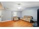 Bright living room with wood floors and comfortable seating, perfect for relaxation at 42 Linford St, Belmont, NC 28012