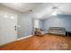 Inviting living room with wood floors, vaulted ceiling, and natural light from the window at 42 Linford St, Belmont, NC 28012