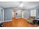 Comfortable living room with wood flooring, ceiling fan, and plenty of natural light at 42 Linford St, Belmont, NC 28012