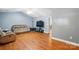 Cozy living room with wood floors, vaulted ceiling, and ample natural light, inviting and spacious at 42 Linford St, Belmont, NC 28012