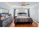 Bedroom with a ceiling fan, wood floors, and natural light at 42 Linford St, Belmont, NC 28012