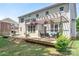 Spacious back deck with pergola, outdoor seating, and lush greenery; great for relaxing and entertaining at 4225 Abernathy Pl, Harrisburg, NC 28075