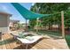 Relaxing backyard deck with lounge chairs and lush trees, perfect for entertaining at 4225 Abernathy Pl, Harrisburg, NC 28075