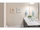Clean, well-lit half bathroom with modern fixtures, dark vanity and neutral decor at 4225 Abernathy Pl, Harrisburg, NC 28075