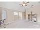 Spacious bonus room with carpet flooring, a ceiling fan, and bright natural light, perfect for entertaining at 4225 Abernathy Pl, Harrisburg, NC 28075