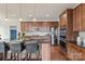 Modern kitchen featuring stainless steel appliances, granite countertops, and a breakfast bar with seating at 4225 Abernathy Pl, Harrisburg, NC 28075