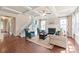 Bright living room with fireplace, coffered ceiling, hardwood floors, and neutral tones at 4225 Abernathy Pl, Harrisburg, NC 28075