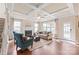 Comfortable living room with coffered ceiling, fireplace, and ample natural light at 4225 Abernathy Pl, Harrisburg, NC 28075