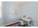 Bright office featuring a desk, comfortable chair, and a calming light blue wall paint at 4225 Abernathy Pl, Harrisburg, NC 28075