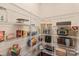 Organized pantry with metal shelving, storing food items and kitchen appliances for convenient access and storage at 4225 Abernathy Pl, Harrisburg, NC 28075