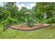 Community playground with slides and climbing equipment, perfect for to play at 4225 Abernathy Pl, Harrisburg, NC 28075