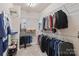 Organized walk-in closet with metal shelving provides substantial storage for clothing and accessories at 4225 Abernathy Pl, Harrisburg, NC 28075
