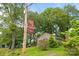 Charming single-story home with brick accents, surrounded by mature trees, near the York Chester sign at 509 W Sixth Ave, Gastonia, NC 28052