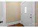 Classic white front door with glass window and stylish hardware at 509 W Sixth Ave, Gastonia, NC 28052