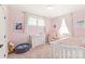 Bright Bedroom with pink walls, white furniture, and natural light from the double window at 5210 Kelly St, Charlotte, NC 28205