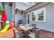 Outdoor deck with table and chairs, grill, and a slide in the backyard at 5210 Kelly St, Charlotte, NC 28205