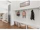 Well-organized entryway with a bench, storage baskets, and hooks for coats and bags at 5210 Kelly St, Charlotte, NC 28205