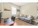 Home office featuring a comfortable couch, workspace and hardwood flooring at 5210 Kelly St, Charlotte, NC 28205