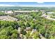 Aerial shot featuring a neighborhood surrounded by abundant trees and lush landscaping at 5238 Downing Creek Dr, Charlotte, NC 28269